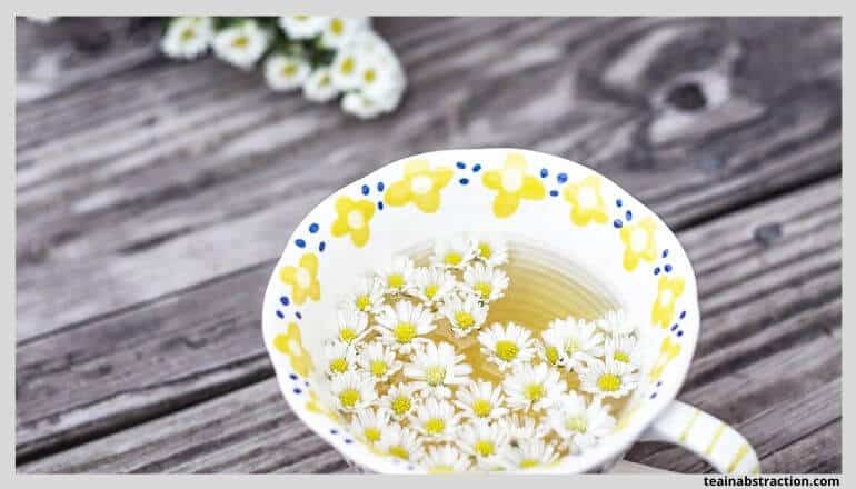 chamomile tea in white cup