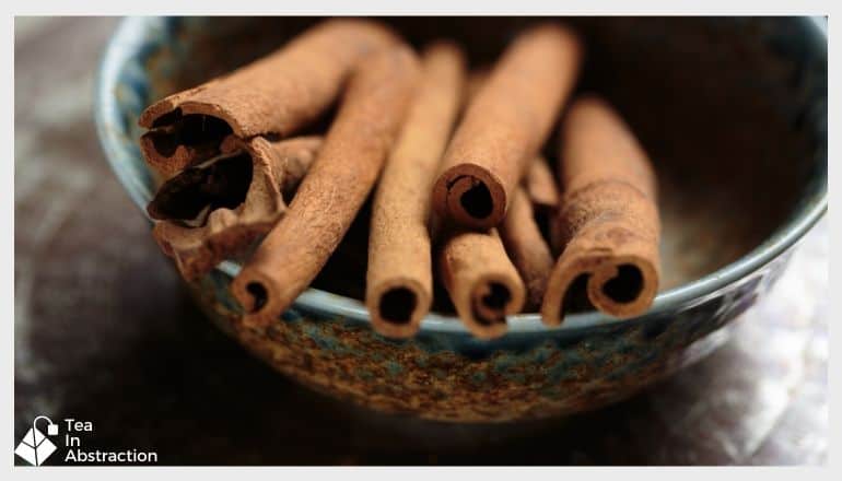 bowl with sticks of cinnamon in it