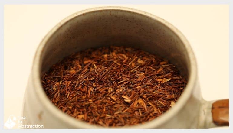 dried rooibos needles in a container for making tea