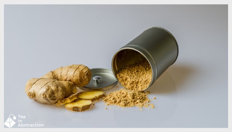 fresh cut ginger next to a tin of powdered ginger